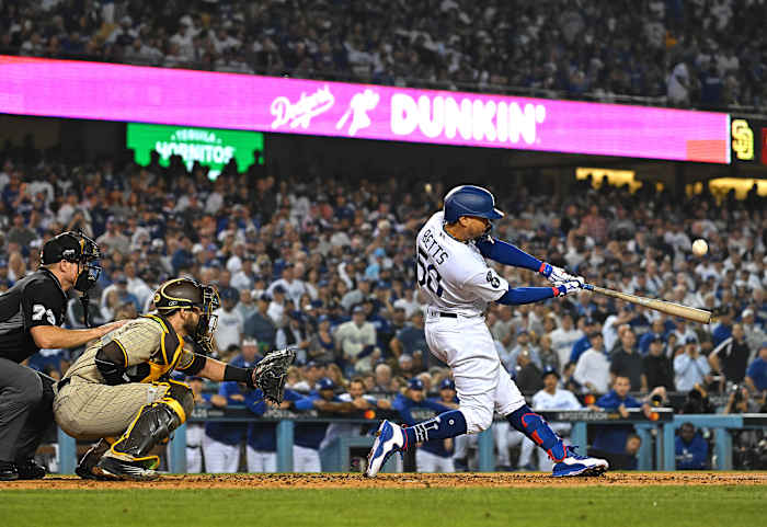 Mookie Betts connects with a pitch during a game for the Dodgers.